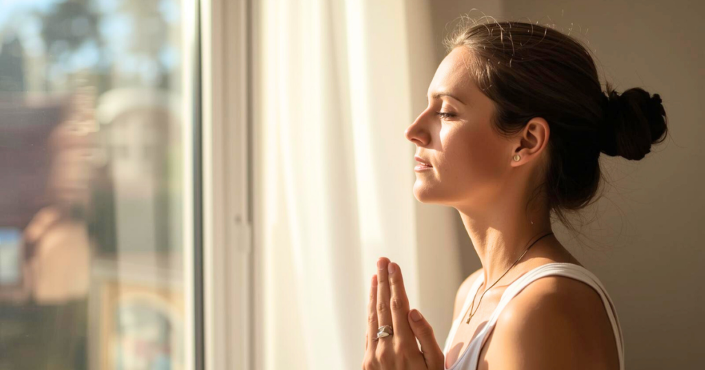 Woman practicing calm breathing at home to reduce stress naturally